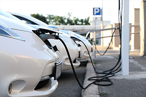 line of cars charging